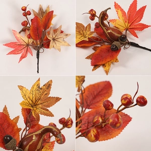 Detailed close-up of autumn decor branch with maple leaves, berries, and acorns