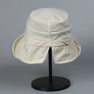 Detail showing back triangle slit of water-resistant nylon sun hat for ponytails