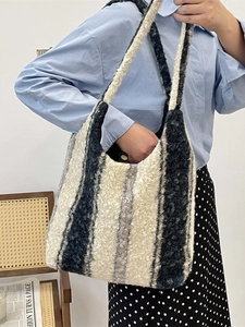 Large plush striped tote bag in black and white fleece with magnetic closure and soft strap