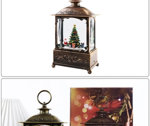 Close-up of vintage bronze Christmas lantern with spinning snow, tree, and gift box detail