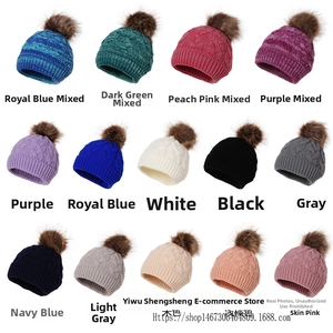 Macro display of assorted knit beanies with large faux fur pom-poms in fourteen various colors