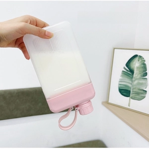 Inverted square water bottle showing leak-proof seal and portable pink strap