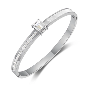 Silver stainless steel bangle with rectangular zircon and diamond accents on white background