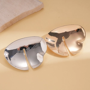 Abstract irregular geometric brooch in polished gold and silver minimalist metal finish