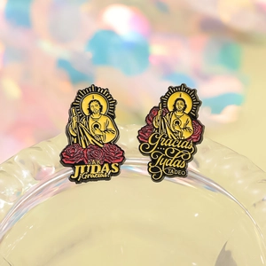 Religious San Judas Tadeo enamel pins with gold trim on glass, sacred themed gift