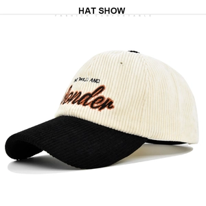 Detailed view of the corduroy texture and Wander embroidery on a two-tone baseball cap