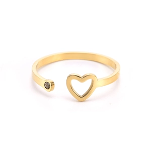 Detail shot of heart cutout with crystal accent on gold adjustable stainless steel ring