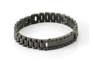 Macro shot of gunmetal stainless steel watch band bracelet with engravable center plate