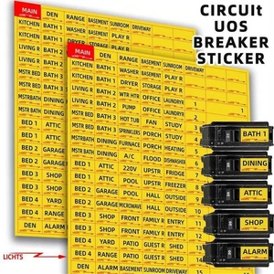 Detail view of yellow circuit breaker stickers with black text on electrical panel