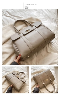 Detail of beige grey tote bag showing metal twist lock and textured leather finish