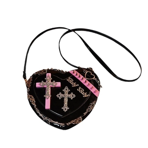 Gothic heart-shaped crossbody bag with pink crosses and metallic studs on black patent leather