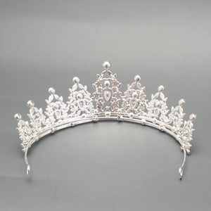 Detailed macro view of the silver vintage crown with intricate rhinestone inlay craft