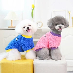 Cozy polar fleece dog sweaters in bicolor blue and pink for small pets in home setting