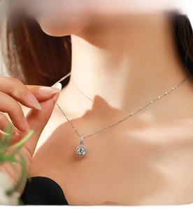 Close-up of S925 sterling silver necklace featuring a sparkling halo zircon pendant