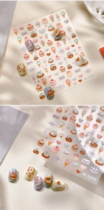 Macro detail of 3D sweet dessert nail art stickers featuring cupcakes and ice cream
