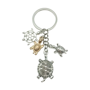 Vintage sea turtle and helm nautical keychain in antique silver and bronze alloy