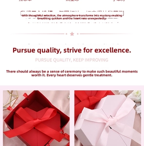 Close-up of heart-shaped gift box featuring a wide silk ribbon bow and paper texture