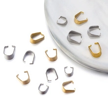 Detailed close-up of gold and silver stainless steel pinch bails for DIY jewelry pendants
