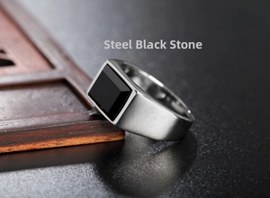 Macro detail of men's steel ring featuring a rectangular black faceted gemstone inlay