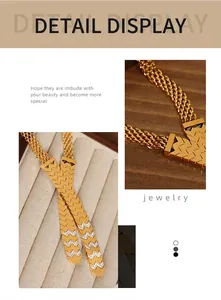 Detailed close-up of gold V-shaped woven chain necklace with sparkling rhinestones