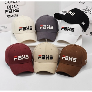 Detailed close-up of premium embroidered FBXS logo on multi-color cotton baseball caps