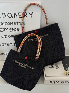 Mini navy denim tote bag with colorful beaded handles and embroidered letters