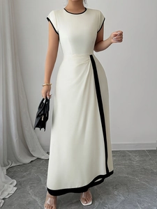 Elegant sleeveless cream long dress with black contrast trim and waist pleat details