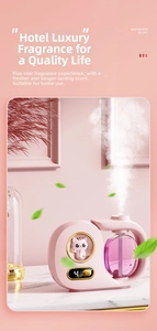 Detail of pink cat aroma diffuser showing dense mist spray and LED digital display screen