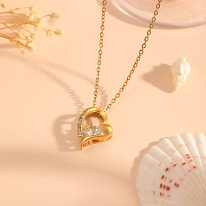 Titanium steel heart pendant necklace with gold finish and sparkling cubic zirconia stones