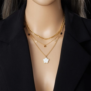 Gold-plated layered stainless steel necklace with floral charms and white pearl pendant