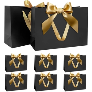 Set of 8 premium black paper gift bags with elegant gold ribbon bows in various sizes