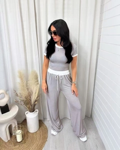 Close-up of grey ribbed fabric texture on the short sleeve top and drawstring waistband