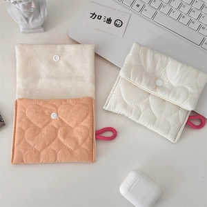 Detailed heart quilted storage pouch for feminine hygiene items with snap closure