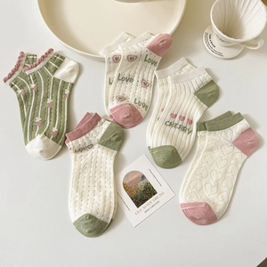 Detail of 5-pack bamboo mesh socks featuring cute cartoon patterns and heart motifs