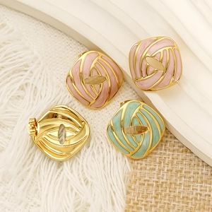 Rhombus enamel stud earrings in pink and mint green with golden geometric accents