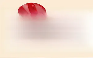 Detailed close-up of soft red silicone shampoo brush with flexible conical bristles