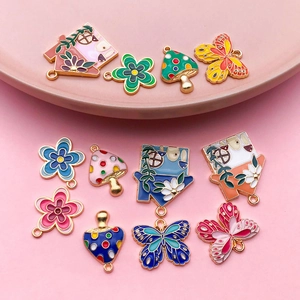 Colorful enamel butterfly and mushroom pendants for DIY necklace and keychain crafting