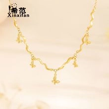 Macro shot of wavy gold necklace featuring five delicate butterfly-shaped charms for women