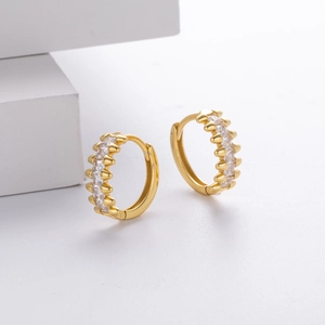 Detail view of gold S925 silver hoop earrings with micro-pave cubic zirconia stones