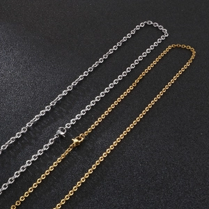Detailed macro of gold and silver minimalist O-chain necklaces with lobster clasps