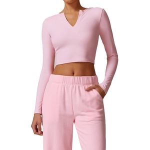Women's pink long sleeve yoga set with slim fit V-neck top and high waist leggings