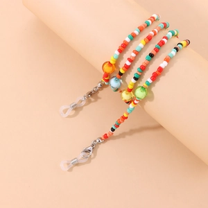 Detail of colorful acrylic beads and metal lobster clasps on a stylish glasses chain strap