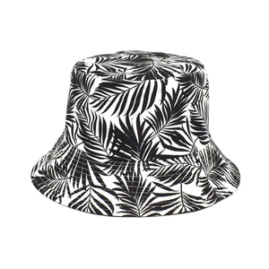 Detail shot of black and white tropical palm leaf print on a cotton bucket hat