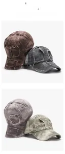 Detailed view of distressed washed cotton baseball caps with vintage frayed holes
