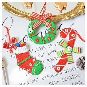 Exquisite polymer clay Christmas ornaments featuring wreath, sock, and candy cane charms
