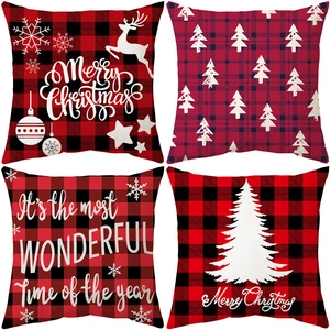 Set of four red and black plaid Christmas pillow covers with white reindeer and tree prints