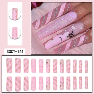 Pink Christmas press-on nails set with reindeer designs and silver glitter stripes