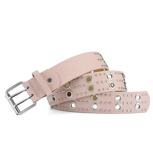 Macro detail of pink punk belt with silver double-pin buckle and metal eyelet rivets