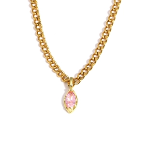 Gold cuban link necklace featuring a marquise cut pink gemstone pendant on white background