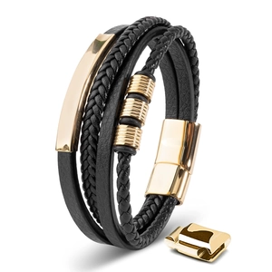 Detail of multi-layer leather bracelet with gold magnetic clasp and woven texture